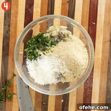 Italian Eggplant Meatballs in Tomato Sauce 7 Boiled eggplant, parsley, garlic, breadcrumbs, parmigiana, salt and pepper in a bowl.