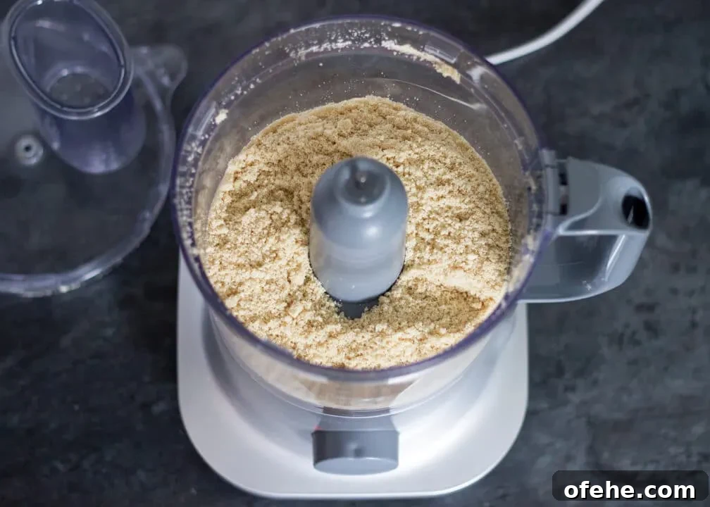 Baked cheesecake biscuit crumb base in a food processor