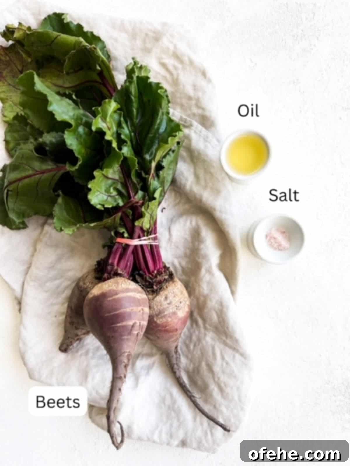 Crispy Air Fryer Beet Chips Recipe 3 One bunch of beets on a linen napkin, oil, and salt.