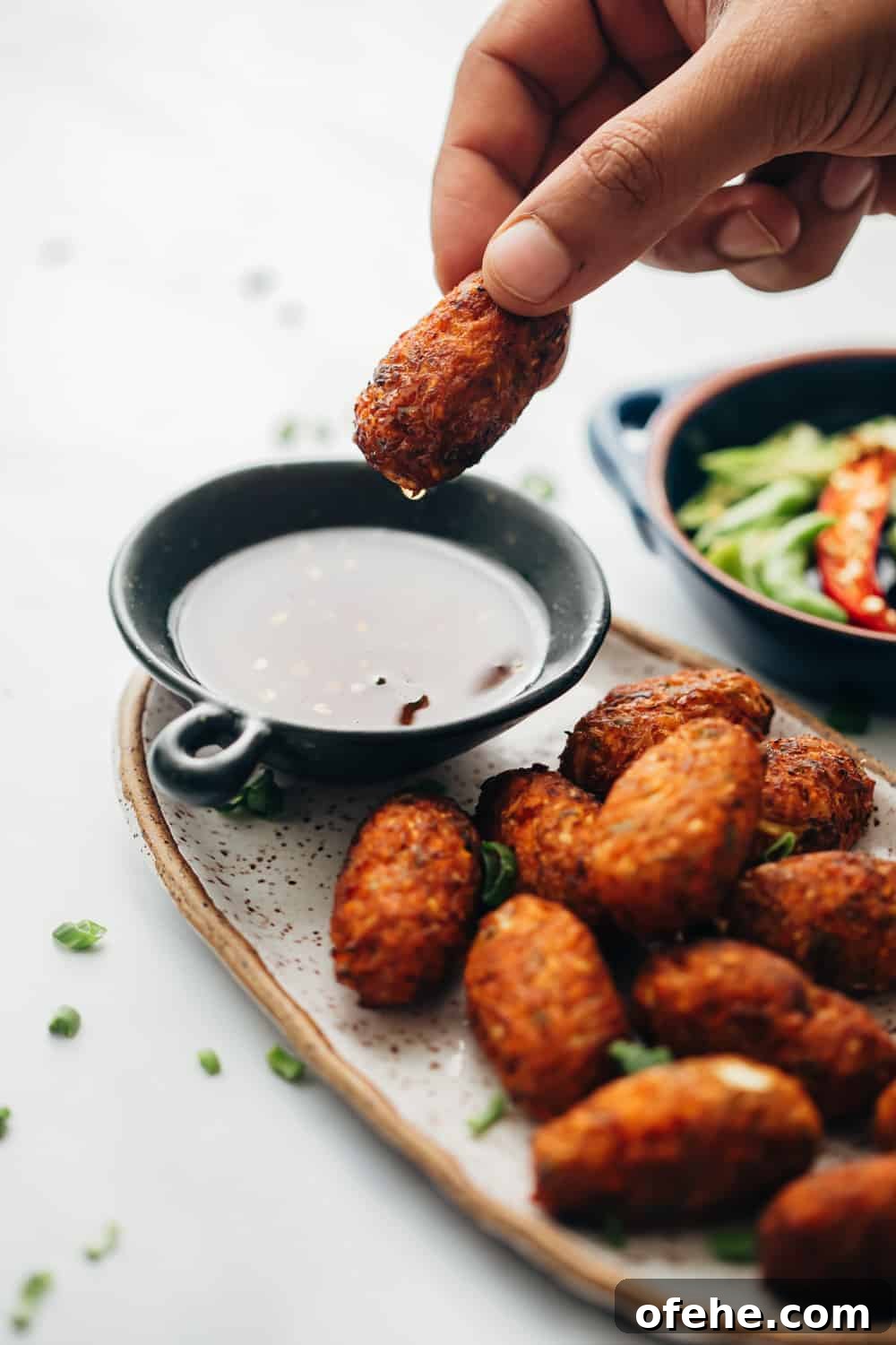 Crispy Vegetable Nuggets with Sichuan Dipping Sauce 2 Dipping crispy veg nuggets in sichuan sauce