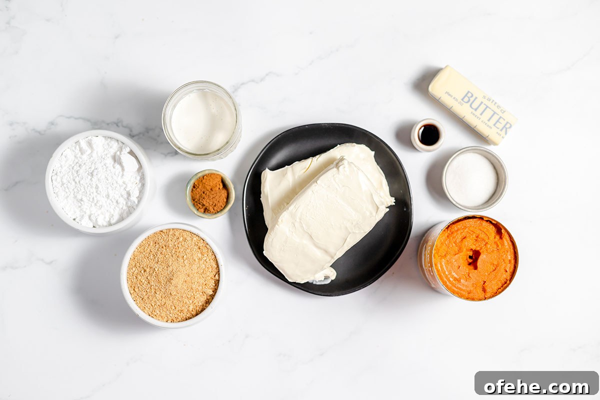 Ingredients to make pumpkin cheesecake set out on the counter.