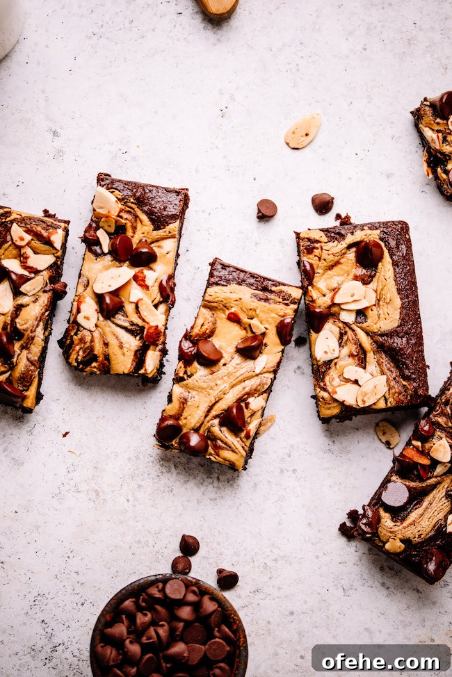 Fudgy Almond Butter Tahini Brownies 5 Almond butter swirled brownies on a backdrop