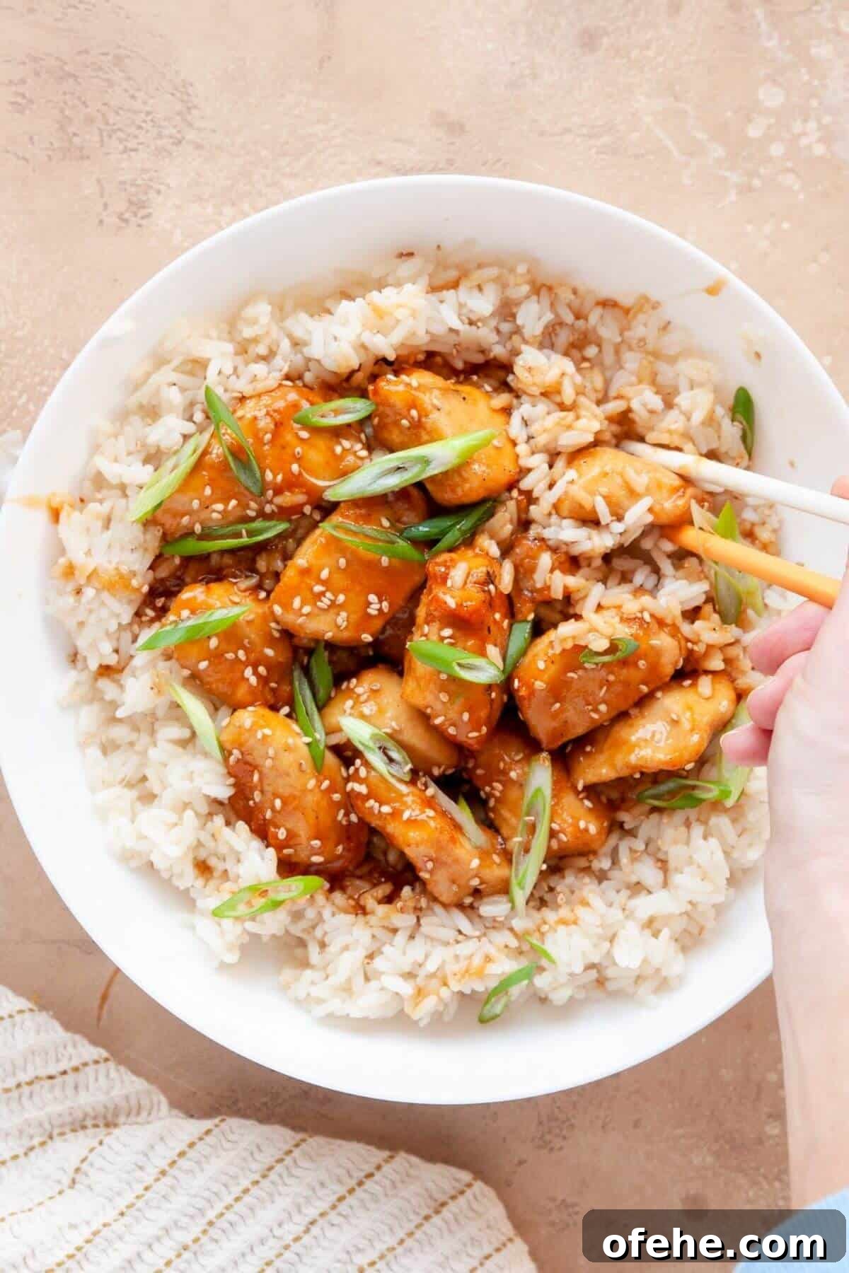 Crispy Sticky Air Fryer Teriyaki Chicken 2 Air fryer teriyaki chicken made without breading, coated in a homemade orange and honey teriyaki glaze.
