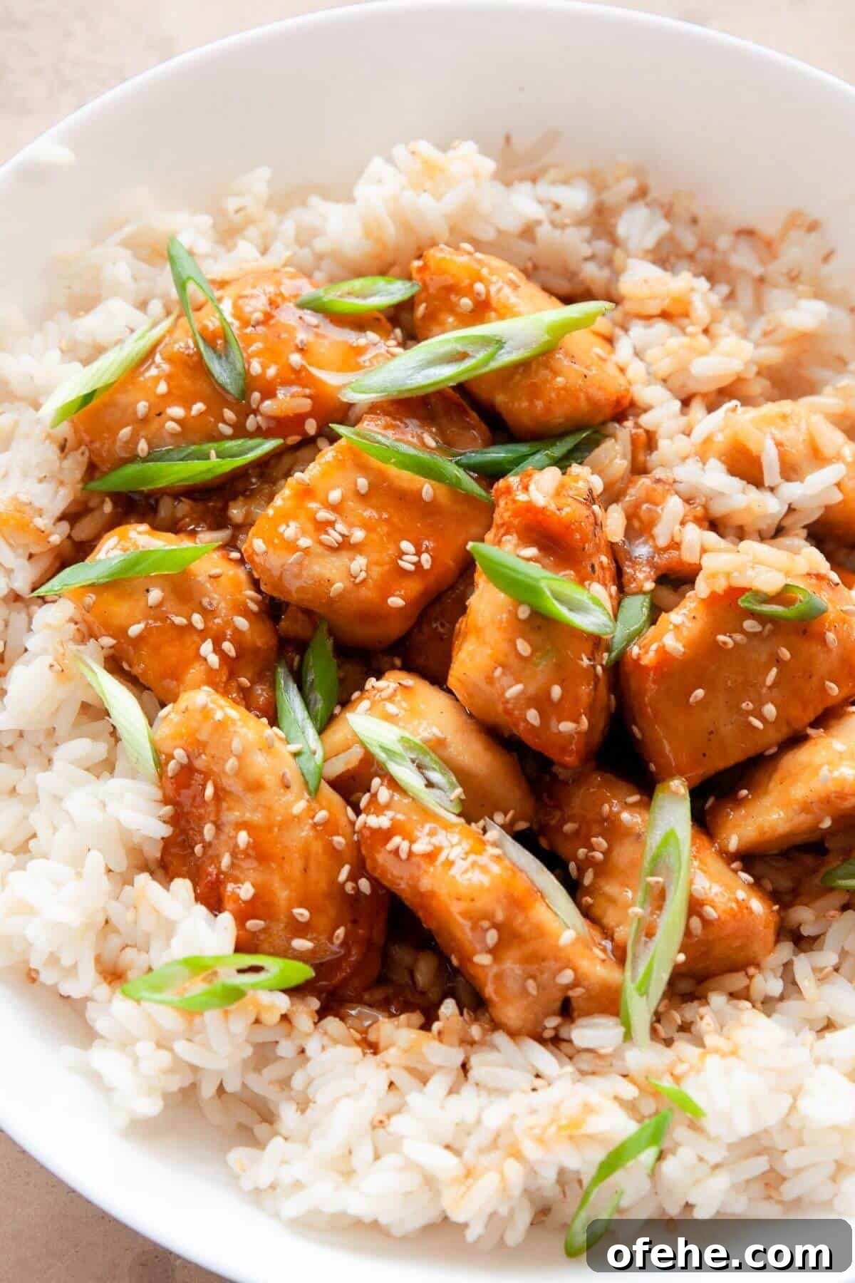Crispy Sticky Air Fryer Teriyaki Chicken 11 15-minute air-fried teriyaki chicken served on a bed of white rice with glossy homemade sauce.