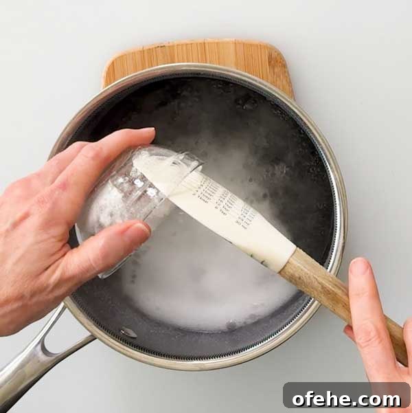 Adding baking soda to the boiling water.