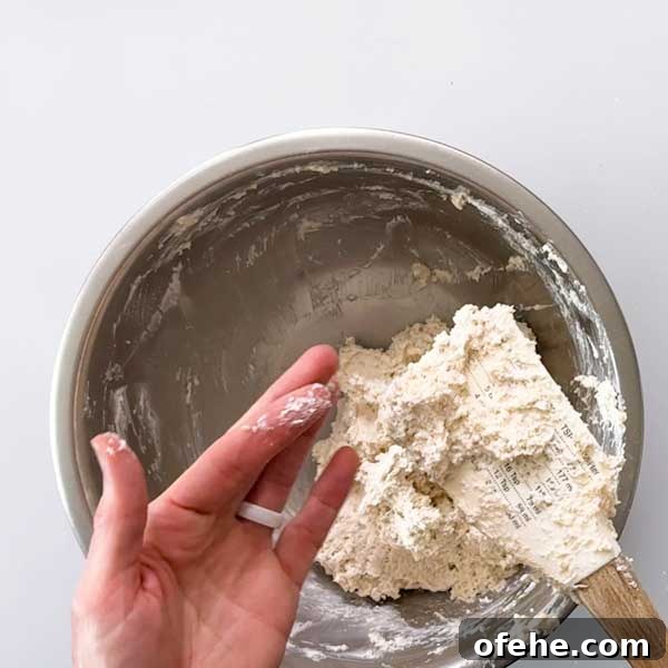 The dough consistency is sticky to the touch.