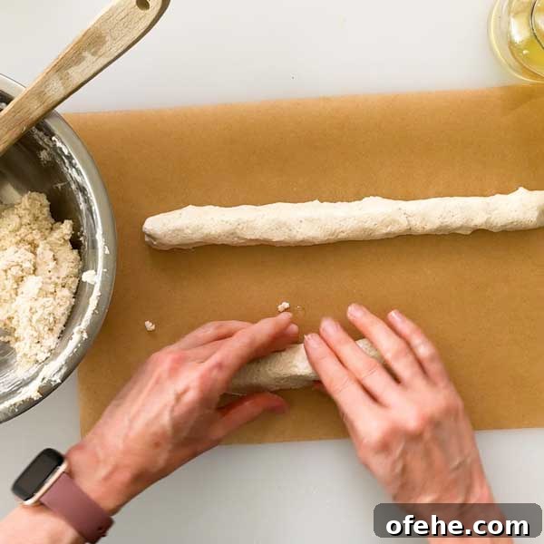 Shaping the pretzel bites dough into long ropes.