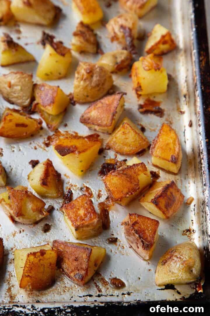 French Onion Soup Potatoes Recipe with Caramelized Onions 9 crispy roasted potatoes on a baking sheet.