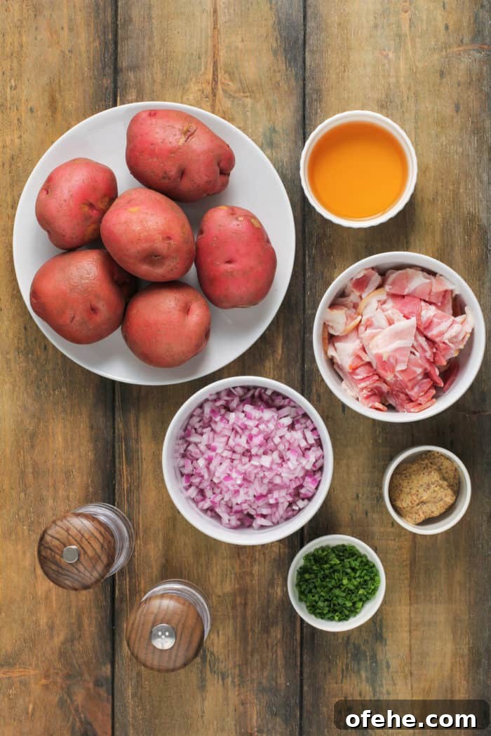 Ingredients for german potato salad on a wooden table.