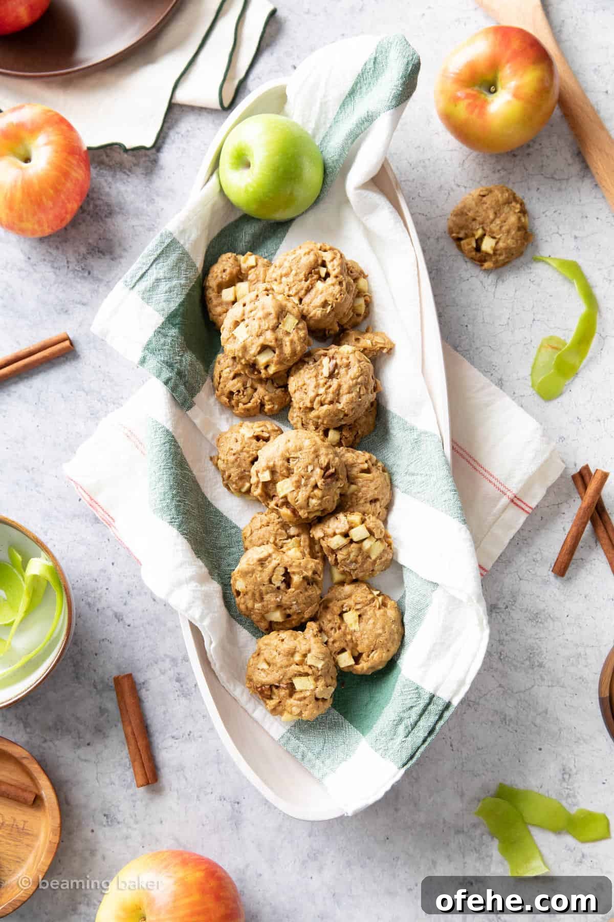 Vegan Apple Pie Breakfast Cookies for Cozy Mornings 3 kitchen table with a basket of apple pie breakfast cookies, apples and cinnamon sticks