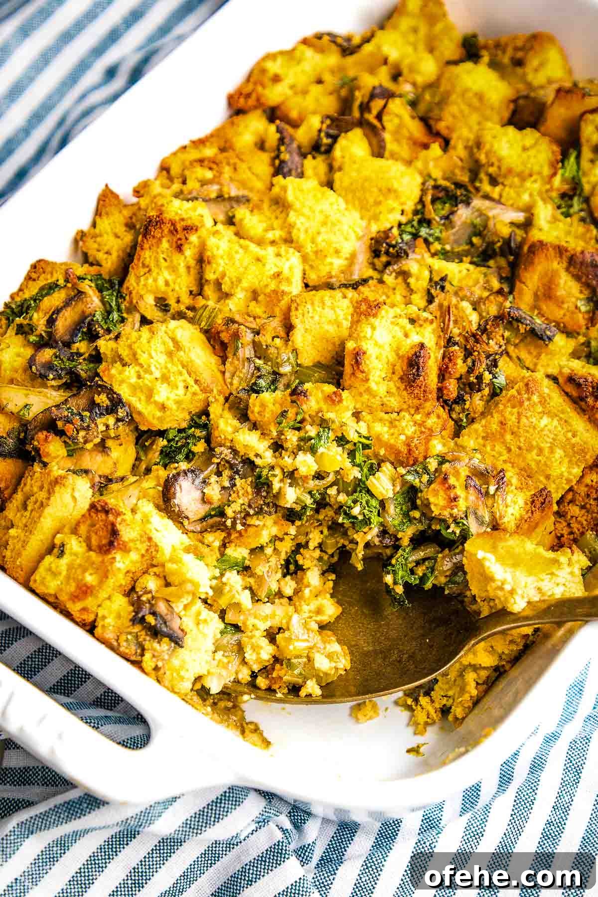Wholesome Thanksgiving Recipes 2025 for a Lighter Feast 8 Cornbread stuffing with mushrooms and herbs in a baking dish.