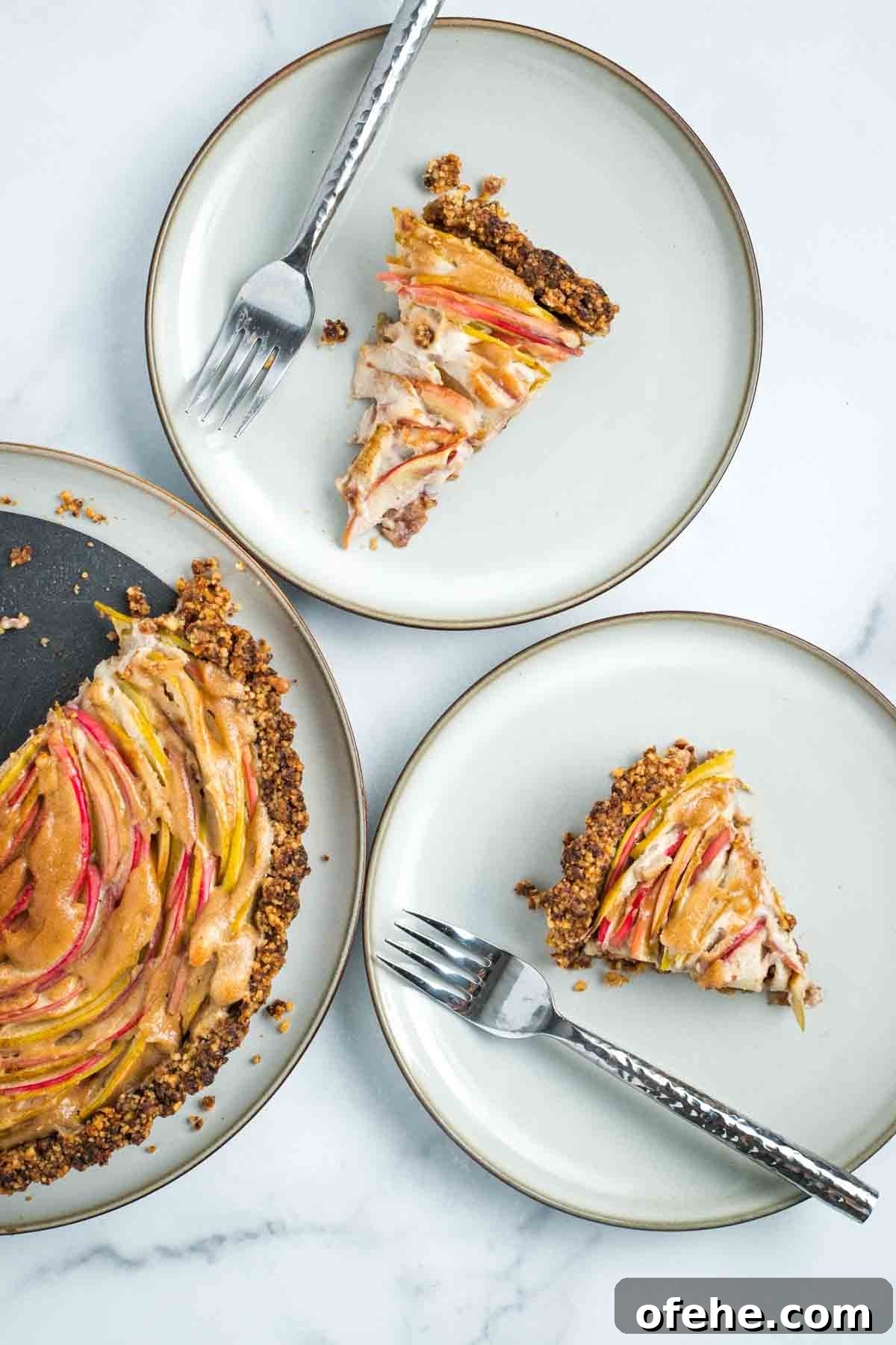 Wholesome Thanksgiving Recipes 2025 for a Lighter Feast 25 Slices of apple tart with vegan custard and walnut date crust.