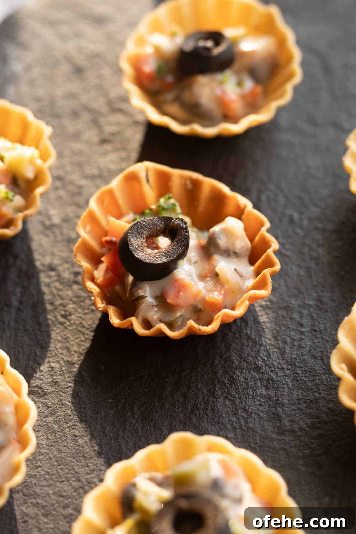 Vegetarian Canapés: Party-Perfect Recipes 2 veg canapes served on a black board ready to be eaten