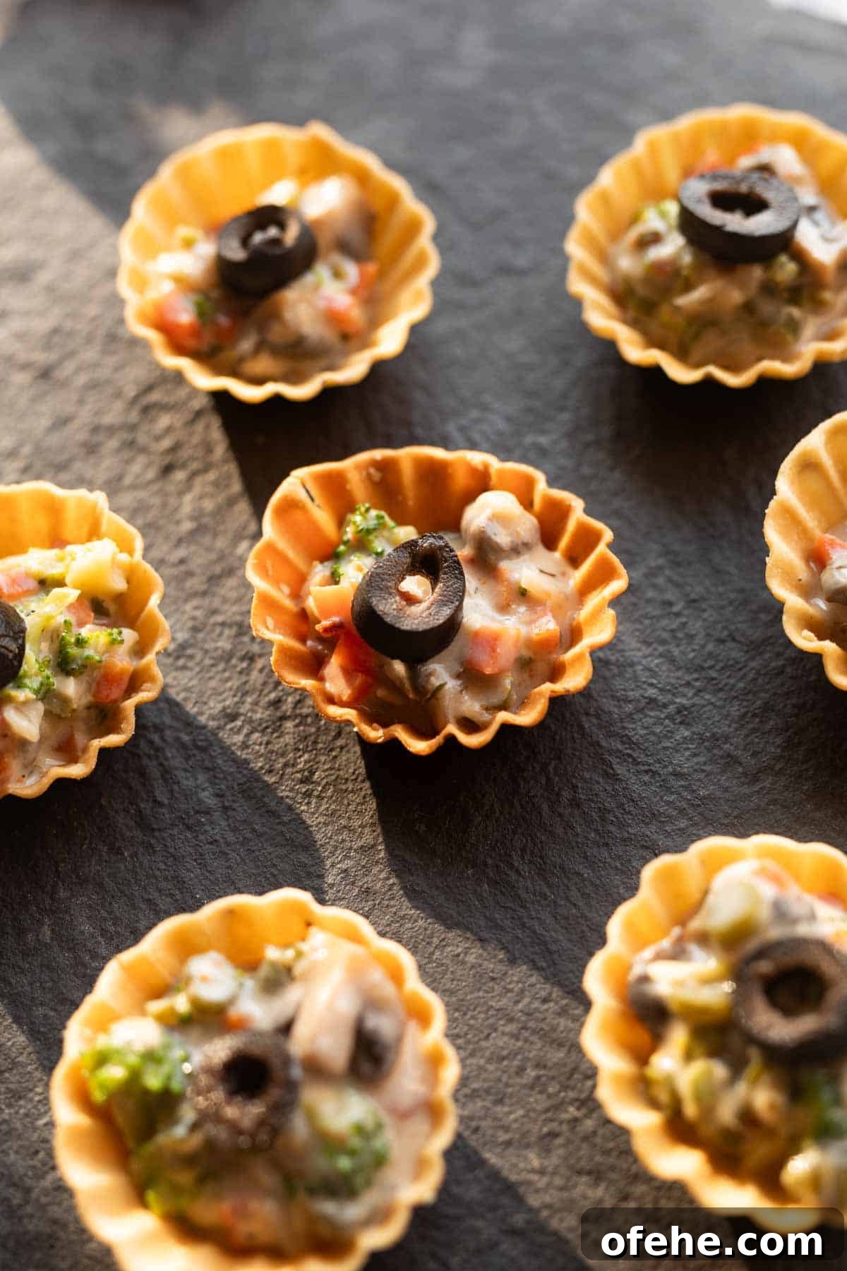Vegetarian Canapés: Party-Perfect Recipes 3 veg canapes served on a black board ready to be eaten