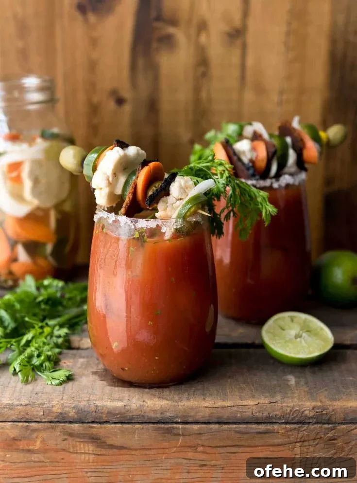Loaded Chipotle Bloody Mary! Full of flavor from fresh cilantro, lime, homemade escabeche and vegan bacon.