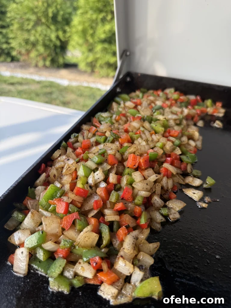 Cheesy Chicken Bacon Ranch Quesadillas 5 chopped vegetables on a griddle