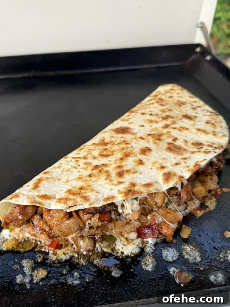 Cheesy Chicken Bacon Ranch Quesadillas 7 half grilled quesadilla on a grill