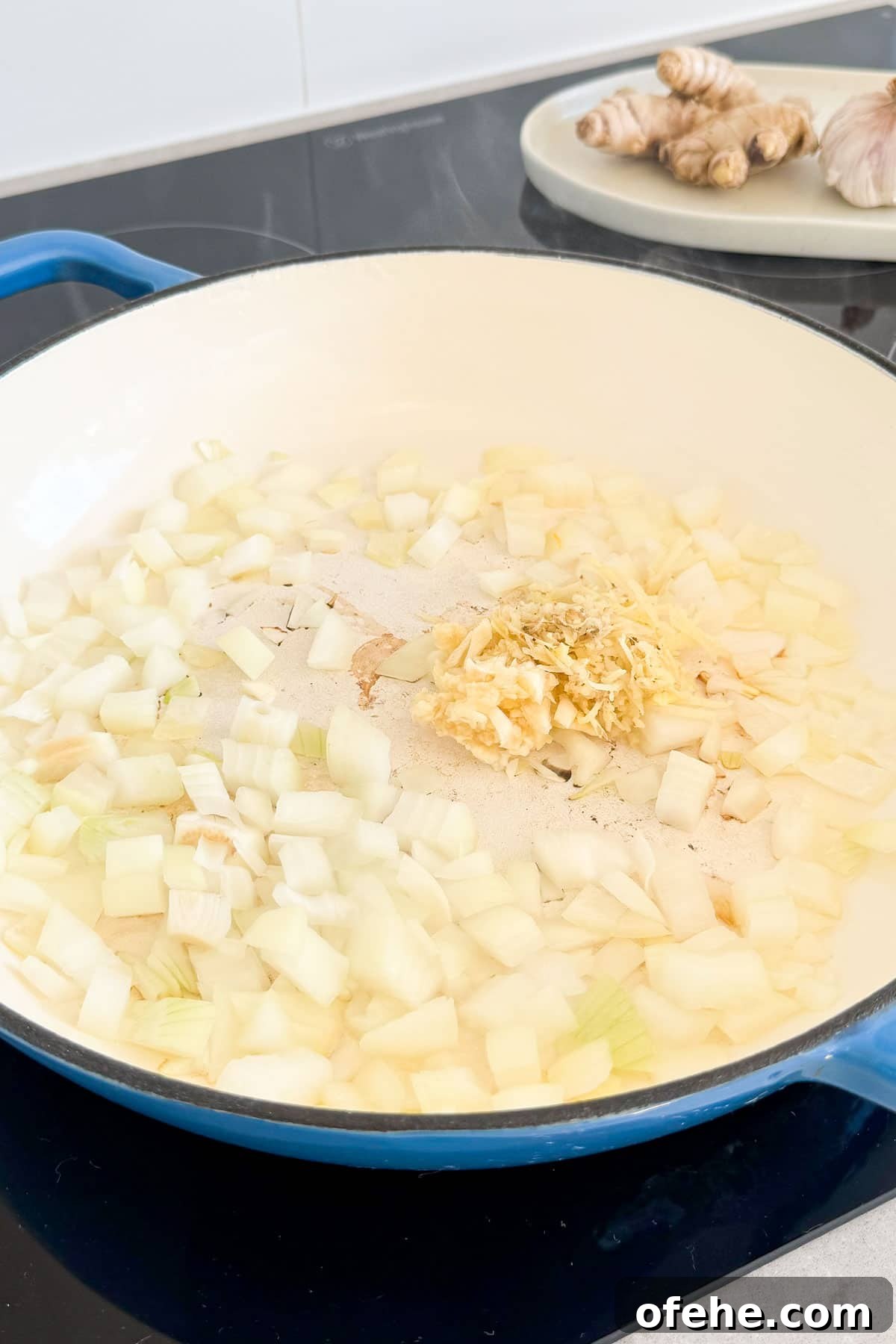 Onion, garlic and ginger being sautéed.